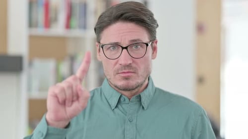 Man Disagreeing and Raising Finger