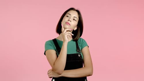 Thoughtful Young Woman Posing in Studio