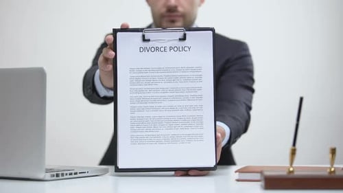 Close Up of Divorce Policy on Clipboard