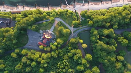 Sparkling Sea Waters Lush Trees By Shore and the Infinite Bridge (Drone Shot)