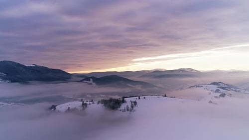 Aerial View in Foggy Sunset Winter Mountain