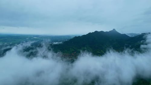 4K Aerial Drone shot flying over beautiful mountain ridge in rural jungle bush forest.