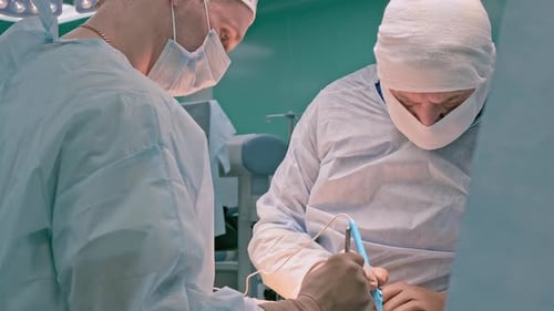 Surgical Procedure Underway with Dedicated Surgeons