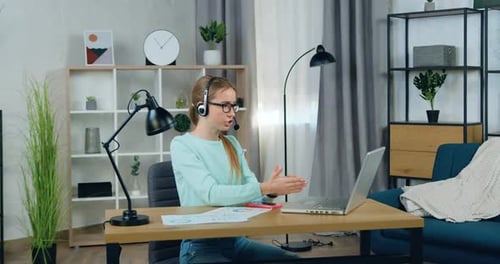 Woman Video Conferencing on Laptop in Bright Room