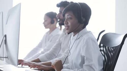 People Work At Contact Center. Woman In Headset Working