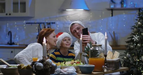 Festive Family Celebrates Christmas with a Selfie