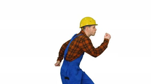 Jeune ingénieur dansant avec casque après le travail sur fond blanc.