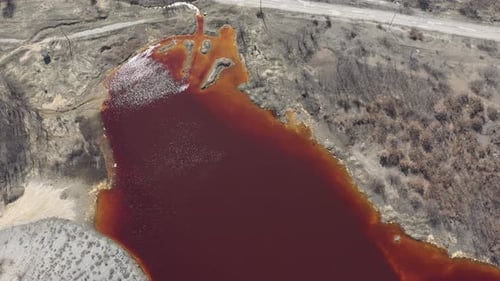 Aerial View of Red Polluted Water and Landscape
