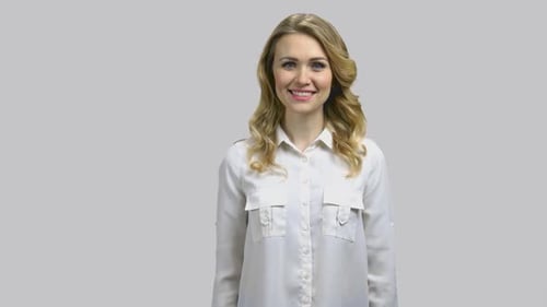 Woman Gives Two Thumbs Up With a Smile