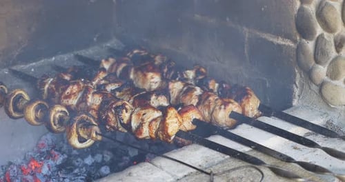 Cooking Meat and Mushroom Skewers on the Grill