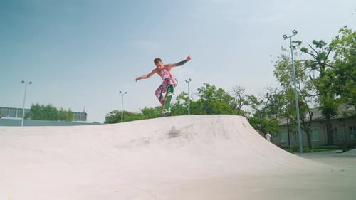 Skateboarder Performs Trick in Urban Skatepark