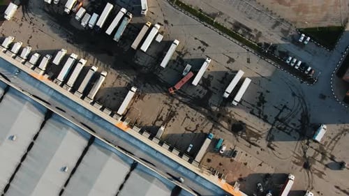 Motion Above Large Trucks with Goods Parking at Warehouse