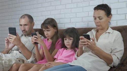 Family Together at Home Using Mobile Phones