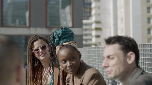 Friends Enjoying a Sunny Day on City Rooftop