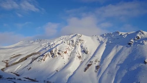 Snowy Mountains Aerial View in Winter Season
