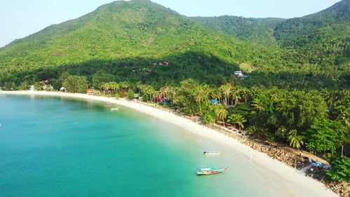 Tropical overhead island view of a sunshine white sandy paradise beach and turquoise sea background