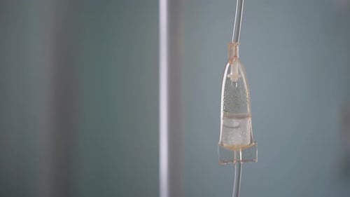 Operation of a Dropper in the Hospital Room Next To Patient