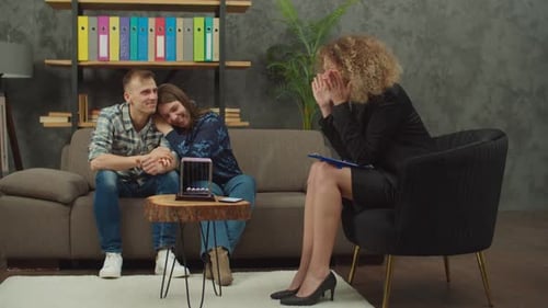 Happy Couple After Successful Therapy Session with Family Psychologist at Office
