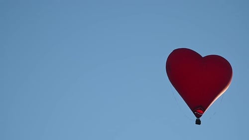 Heart Shaped Balloon Floating in Sky