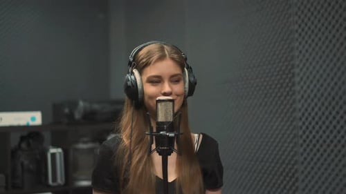 Expressive Woman Singer Records New Song in Audio Studio
