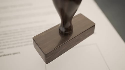 An important document being denied by red office stamp in slow motion. 4KHD