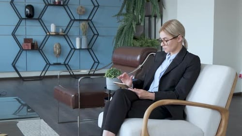 Young woman using digital tablet computer in office
