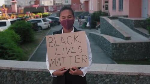 Young Adult Holds Black Lives Matter Sign