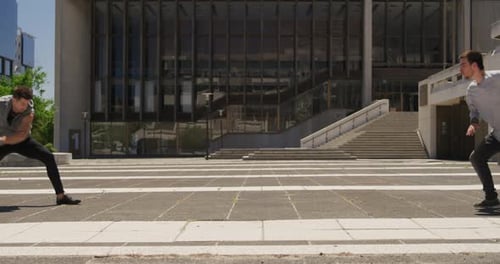 Acrobatic Pair Perform Urban Dance Routine Outdoors