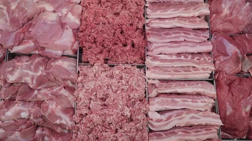 Pieces of Fresh Raw Meat in a Shop Window