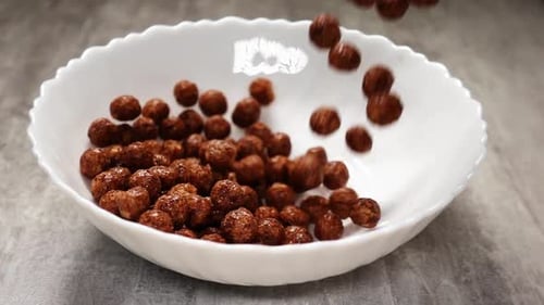 Chocolate Puff Cereal Poured into Bowl