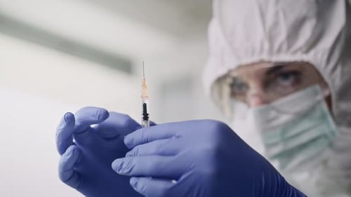 Scientist Prepares Vaccine Injection in Lab Close Up