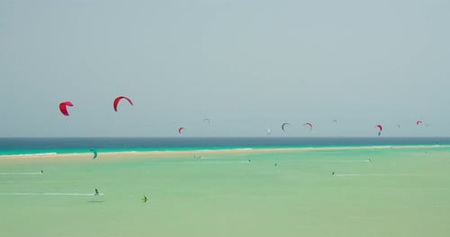 Kitesurfers Enjoying Sunny Day in Tropical Lagoon