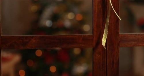 Hanging Christmas Decorations with Glowing Bokeh Lights