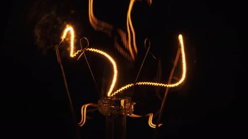 The Tungsten Filament in Classic Incandescent Glass Lamp Heats Up and Cools Down