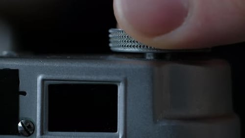 Rotating Camera Dial on Silver Camera Body