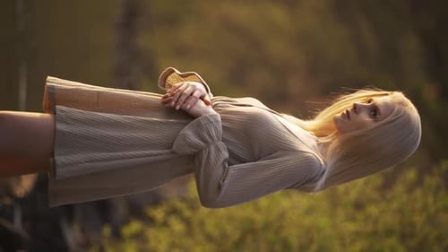 Relaxed Girl Playing Hair Admiring Sea at Sunset Back View Panning Shot Adorable Travel Woman Female