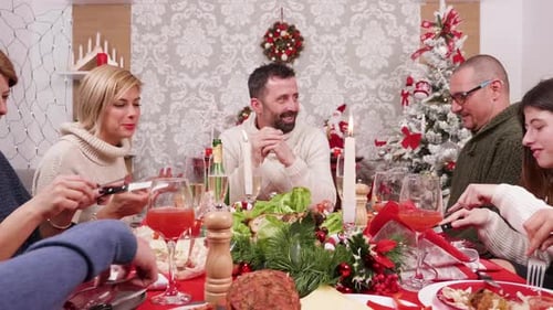 Family Celebrates Christmas Holiday Meal Together