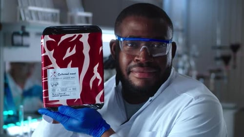 Scientist Holding Cultured Meat in Lab