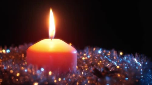 Close Up of Candle with Christmas Decorations