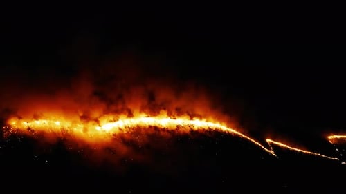 Fire In The Field With Stubble Of Wheat At Sunset