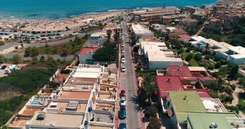 Aerial View of Tourist City From Drone Overlooking the Beach and Blue Sea Water