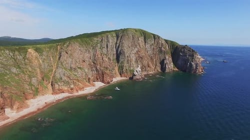 View From a Drone of the Coastline with a Rocky Coast and High Cliffs