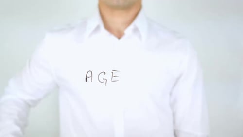 Adult Writes 'Age' on Clear Surface with Marker