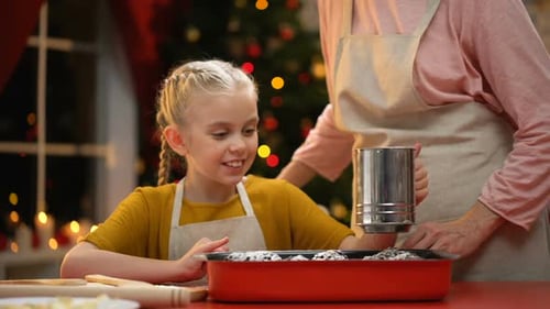 Child Baking Cookies with Friend for Christmas
