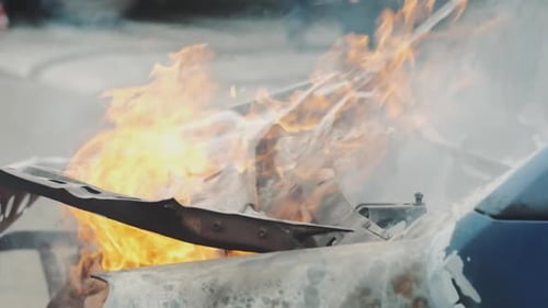 Car Burns After a Road Accident