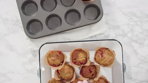 Baked Muffins being Placed on a Tray