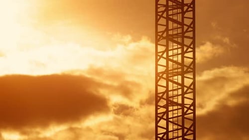 Ladder of Tower Crane Construction Site Sunset Light, Orange Sky Moving Clouds Morning or Evening