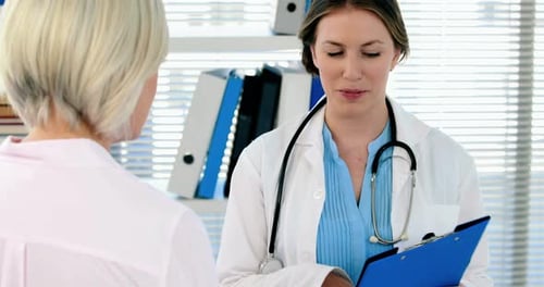 Doctor Talking to Patient in Medical Office