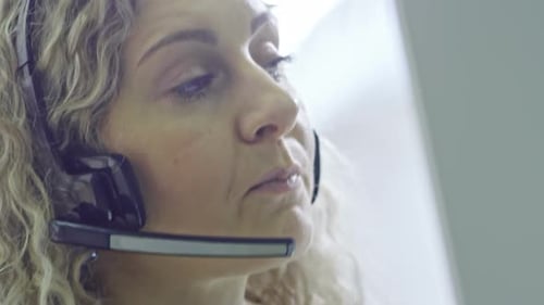 Female Operator of Call Centre Talking