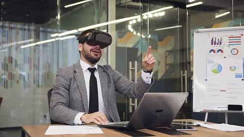 Excited Man Uses VR Headset at Office
